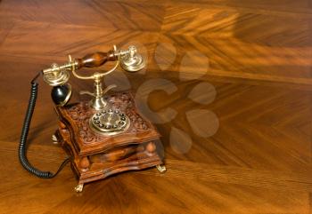 Old-fashioned telephone on the wooden table