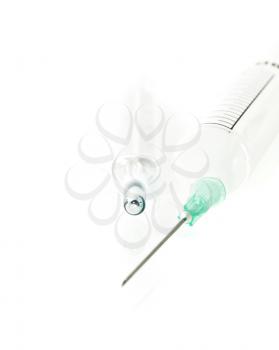 Old-fashioned thermometer and disposable syringe over white 