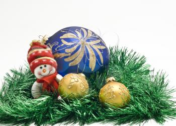 Plush Christmas toy with three colorful New Year decoration Balls in green tinsel over white