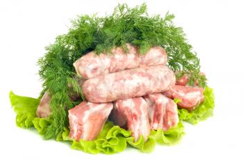 Pork meat, Sausages and dill on green salad. Isolated over white