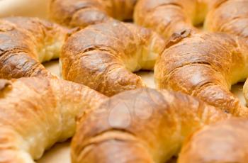 Breakfast time - group of tasty crescent rolls or croissants