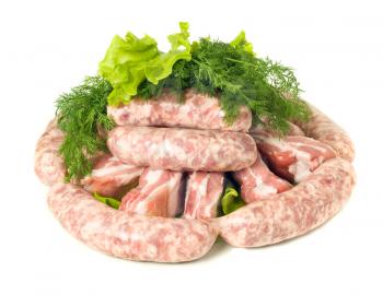 Tasty meat. Pieces of Pork and Sausages. Isolated over white