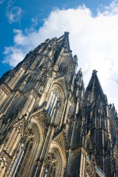 Towers of Koelner Dom (Cologne Cathedral) over blue sky in Koelne (Cologne)