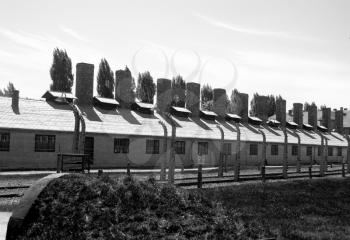Wire fence and barracks in Auschwitz - Birkenau concentration camp
