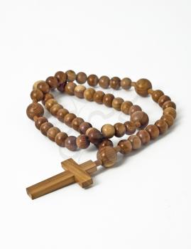 Wooden beads isolated over white (shallow DOF)