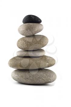 Balanced stone stack or tower isolated over white
