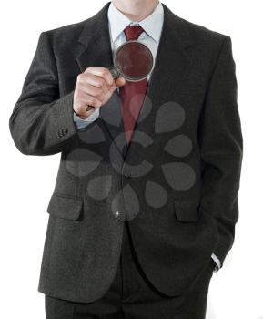 Businessman with magnifier isolated on the white