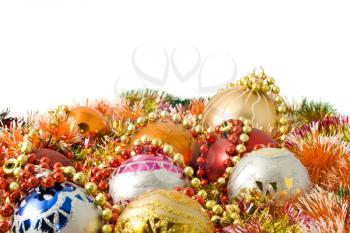 Christmas and New Year decoration - colorful tinsel and balls over white background