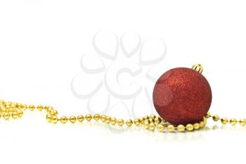 Christmas. Colorful red ball and golden beads over white background