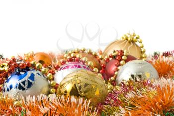 Christmas greeting - group of balls and colorful beads and over white
