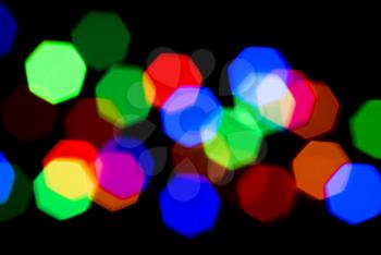 Festive colorful Blurred lights over black useful as background

