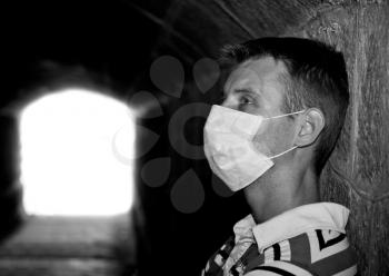 Man with Gauze bandage in dark tunnel (black and white)
