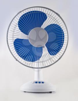 Modern desk cooling fan over white and grey background