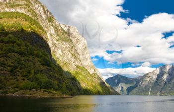 Norwegian Fjord: Mountains and cloudy sky in autumn