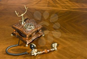 Pick up the phone. Old-fashioned telephone on the table