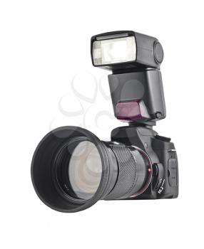 Professional camera with telephoto lens and flash isolated over white