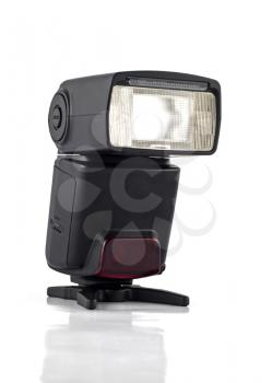 Professional flash on stand for digital camera isolated over white