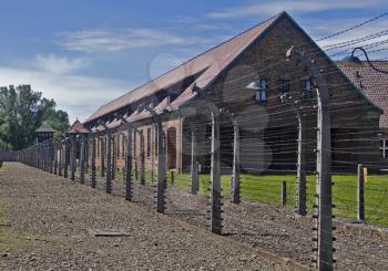 Wire fence and barrack in A uschwitz - Birkenau concentration camp, Poland