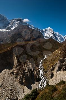 Himalaya landscape: stream and snowed peaks. Captured in Sagarmatha National park