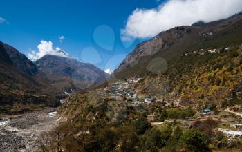 Landscape in Himalaya: peaks and highland village. Pictured In Nepal