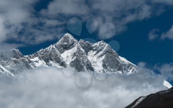 Lhotse, Lhotse shar peaks and cloudy sky in Himalaya. Hiking in Nepal. 