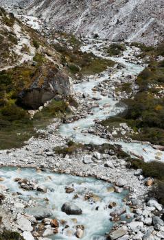 Serpentine stream and rocks in Himalayas. Captured in Sagarmatha National park