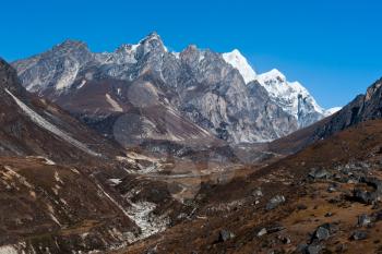 Environment: drained stream and mountains in Himalaya. Pictured in Nepal