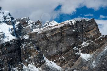 From the top of Gokyo Ri: rocks and snowed cliffs view. Hiking in Nepal
