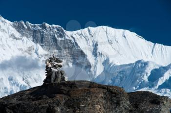 Harmony: Stone stack and mountain range in Himalayas. Gokyo, Nepal