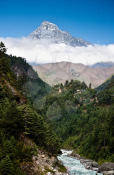 Himalaya mountains Landscape: peak, stream and forest. Travel to Nepal