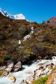 Landscape in Himalayas: snowed peaks and stream. Hiking in Nepal