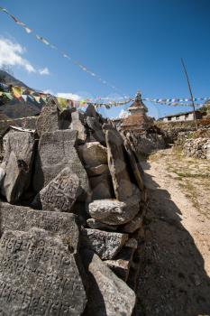 Mani stones and Buddhist stupe or chorten in Himalayas. Religion in Nepal