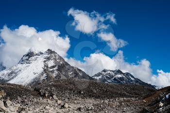 Summit and clouds near Sacred Lake of Gokyo in Himalayas. Hiking in Nepal