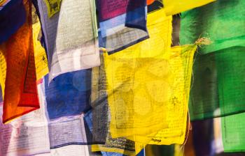 Colorful buddhist Prayer flags with mantras. religion in Asia