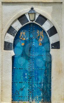 Old Blue door with arch from Sidi Bou Said in Tunisia