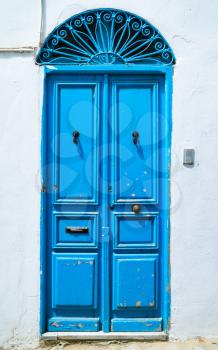 Aged Blue door in Andalusian style from Sidi Bou Said in Tunisia. Large resolution