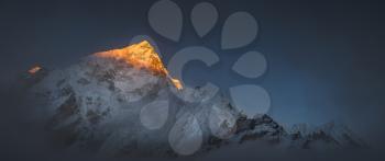Himalya summits Everest and Nuptse at sunset. Large panoramic view