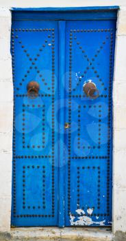 Blue aged door with ornament from Sidi Bou Said in Tunisia. Large resolution