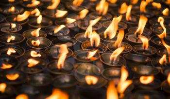 large group of Candles at Buddhist temple. Close up capture