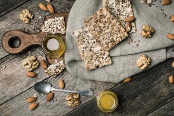 Cookies with seeds, nuts, honey on wooden table. Rustic style and autumn food photo