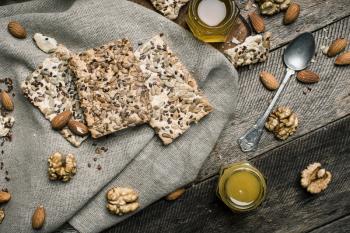 dietic Cookies with seeds nuts honey on wood. Rustic style and autumn food photo