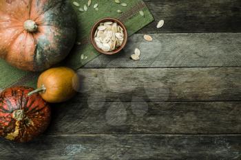 pumpkins and seeds in Rustic style on wood. Autumn Season food photo
