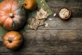 pumpkins with cookies and seeds in Rustic style . Autumn Season food photo