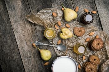 Pears nuts Cookies and joghurt on rustic wood. Rustic style and autumn food photo