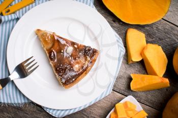 Breakfast piece of pie and Pumpkin slices in Rustic style. food photo