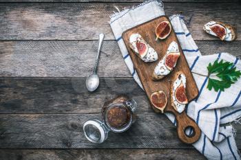 tasty Snacks with cheese jam and figs on wood. Breakfast, lunch food photo
