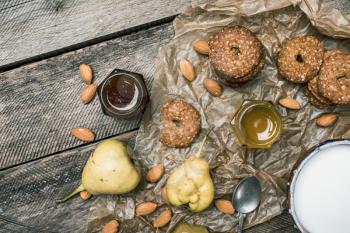 Pears nuts Cookies and milk on rustic wood. Rustic style and autumn food photo