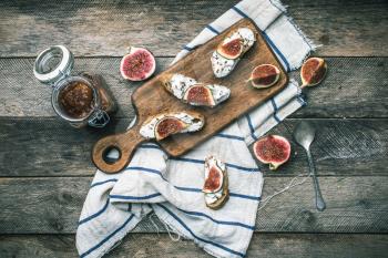 rustic style Bruschetta with cheese and figs on napkin. Breakfast, lunch food photo