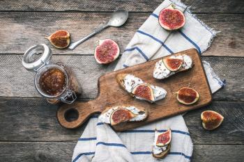 rustic style food snaks with jam and figs on napkin. Breakfast, lunch food photo