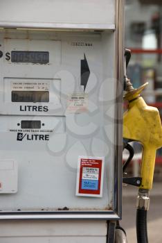 Royalty Free Photo of a Gas Pump With French and English Labels